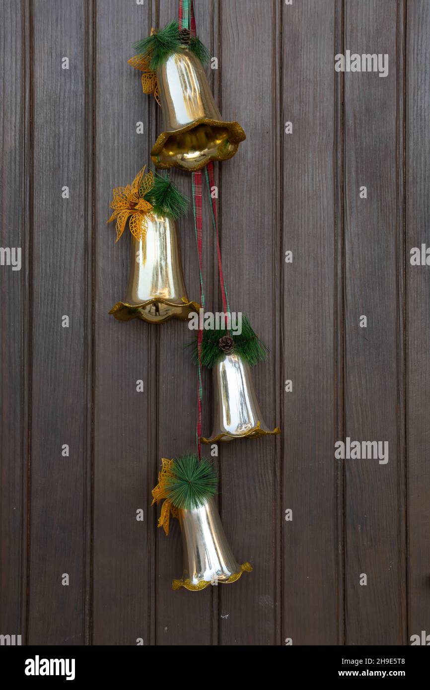Close-up of Christmas decorations on the street on a wooden door Stock Photo
