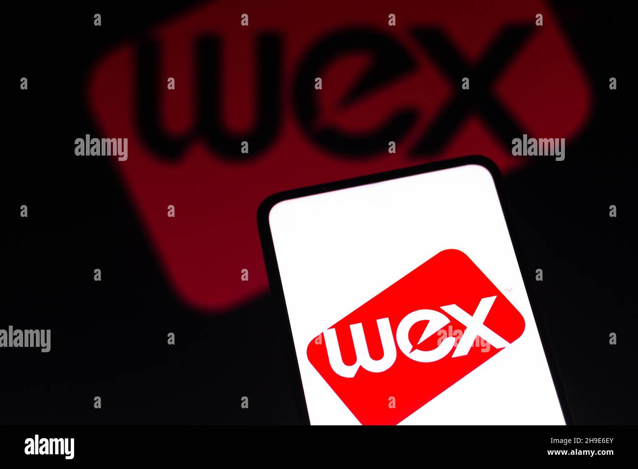 In this photo illustration the WEX Inc. logo seen displayed on a ...