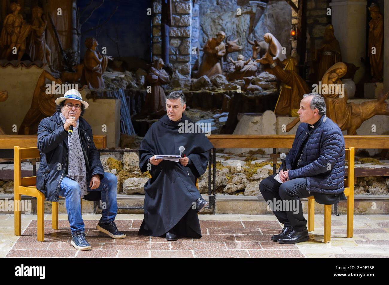 Rieti, Italy. 04th Dec, 2021. Italian singer-songwriters Al Bano Carrisi (L) talks about St. Francis at the Sanctuary of Greccio event for the 100th anniversary of the magazine San Francesco in Rieti, Italy, on December 4, 2021. The dialogue on the theme of 'rebirth' was attended by the Guardian of the Sanctuary of the First Crib, Father Carlo Serri, the mayor of the city, Emiliano Fabi and singer-songwriter Al Bano. (Photo by Riccardo Fabi/Pacific Press/Sipa USA) Credit: Sipa USA/Alamy Live News Stock Photo