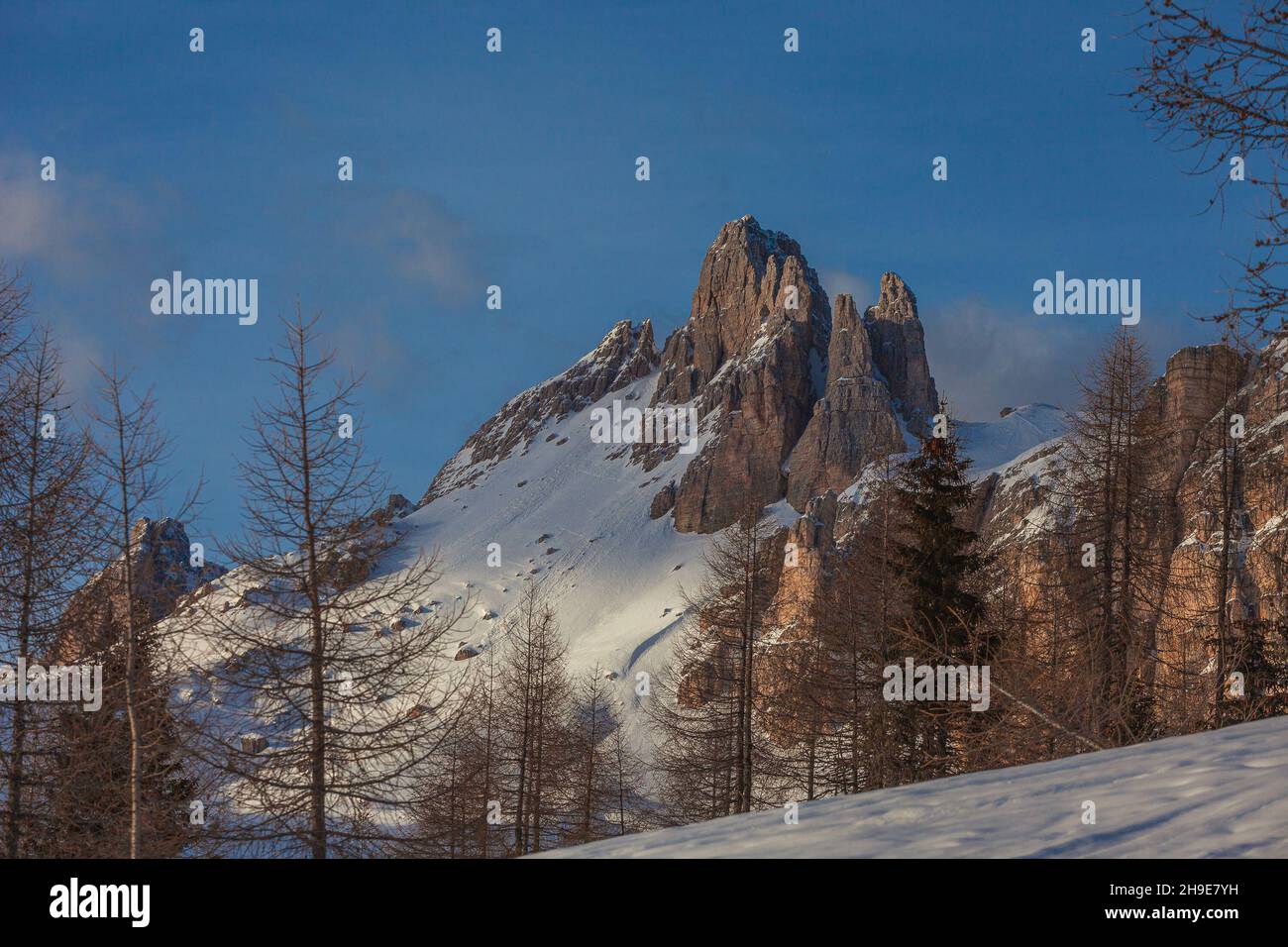 Western face of Rocchetta Peak illuminated by the setting sun Stock Photo