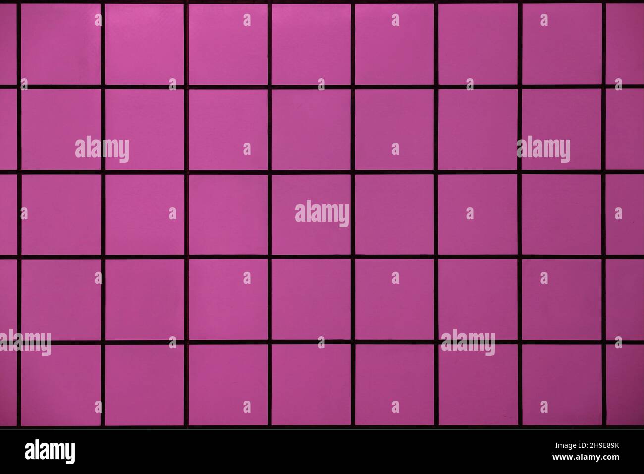 Pink tile wall with geometric pattern as background material Stock