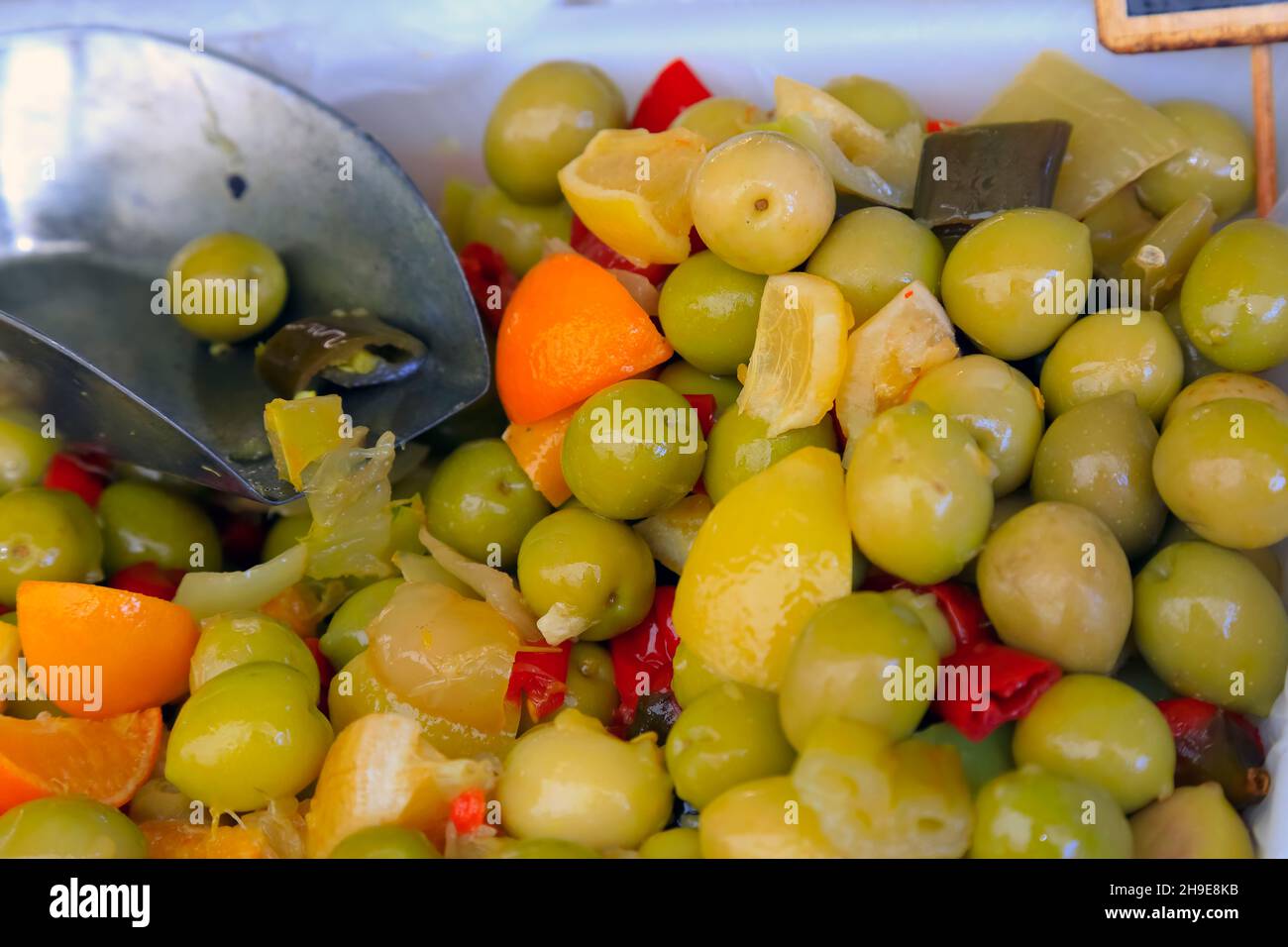 During the food market in Nice, France, you can see and buy a selection of various types of olives with selection of additives. Such blends are ready Stock Photo