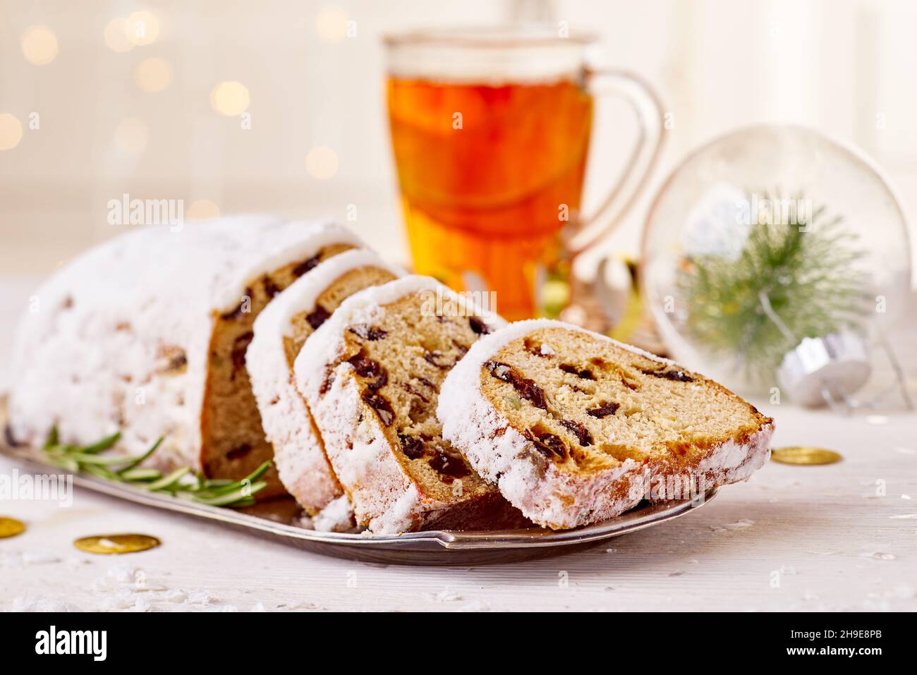 Christmas cake with xmas decorations on light wooden background Stock Photo