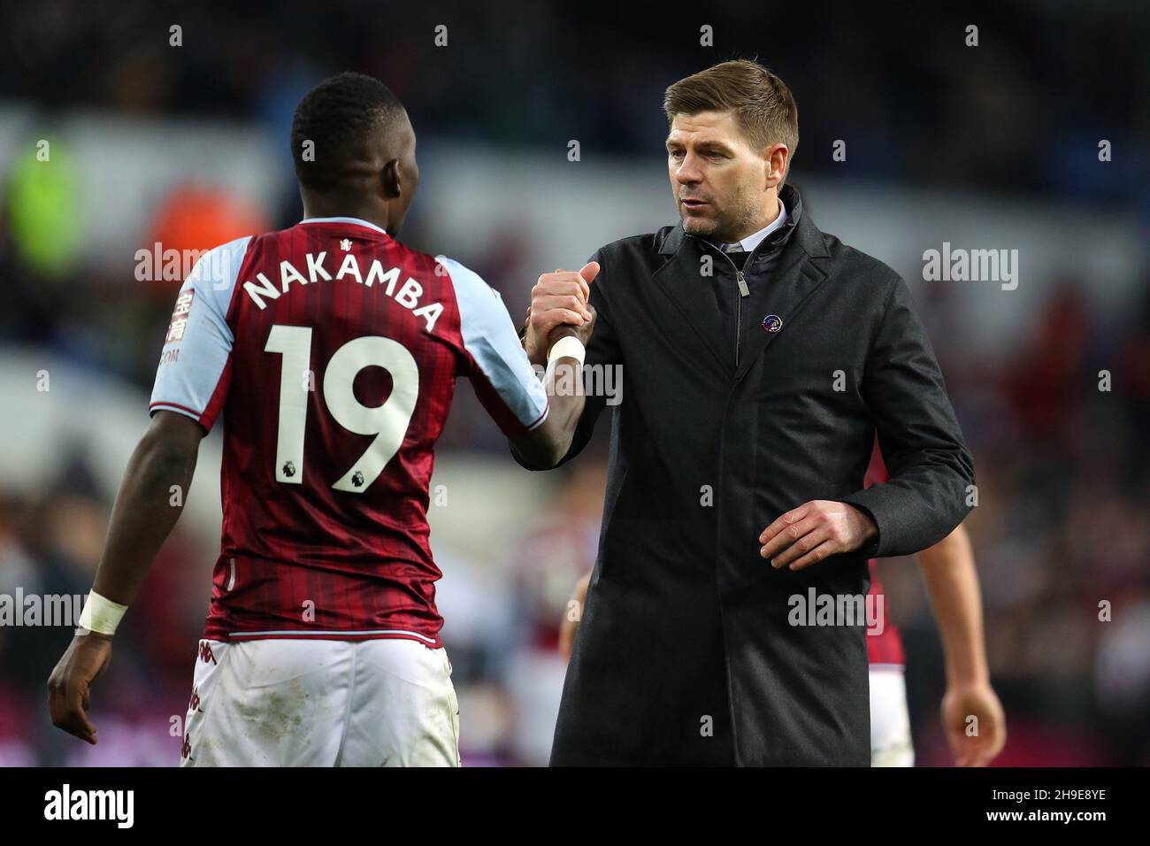 Birmingham, UK. 05th Dec, 2021. Steven Gerrard, the manager of Aston Villa FC (r) with Marvellous Nakamba of Aston Villa after the game. Premier League match, Aston Villa v Leicester City at Villa Park in Birmingham on Sunday 5th December 2021. this image may only be used for Editorial purposes. Editorial use only, license required for commercial use. No use in betting, games or a single club/league/player publications. pic by Andrew Orchard/Andrew Orchard sports photography/Alamy Live news Credit: Andrew Orchard sports photography/Alamy Live News Stock Photo