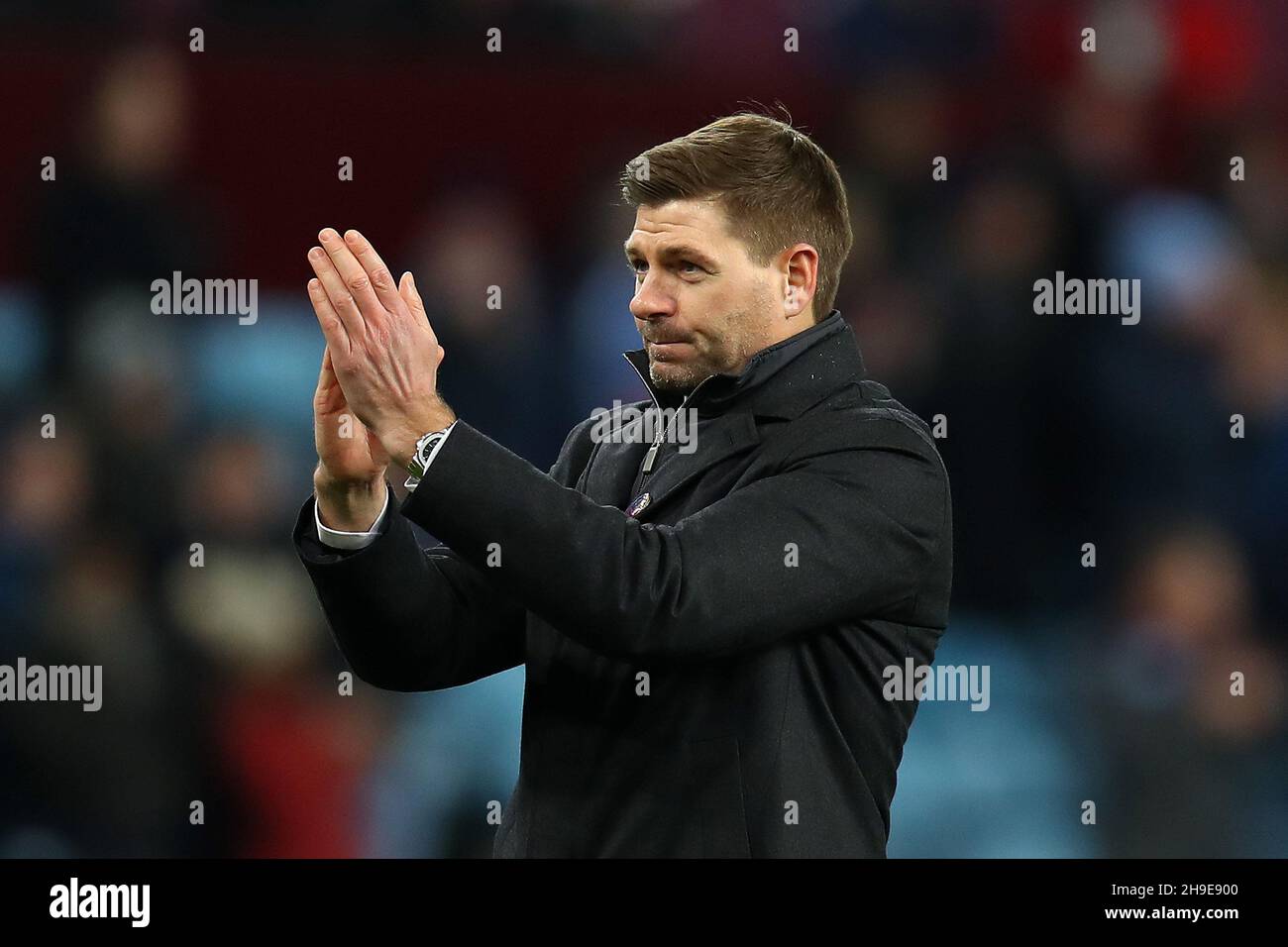 Birmingham, UK. 05th Dec, 2021. Steven Gerrard, the manager of Aston Villa FC applauds the Villa fans after the game. Premier League match, Aston Villa v Leicester City at Villa Park in Birmingham on Sunday 5th December 2021. this image may only be used for Editorial purposes. Editorial use only, license required for commercial use. No use in betting, games or a single club/league/player publications. pic by Andrew Orchard/Andrew Orchard sports photography/Alamy Live news Credit: Andrew Orchard sports photography/Alamy Live News Stock Photo