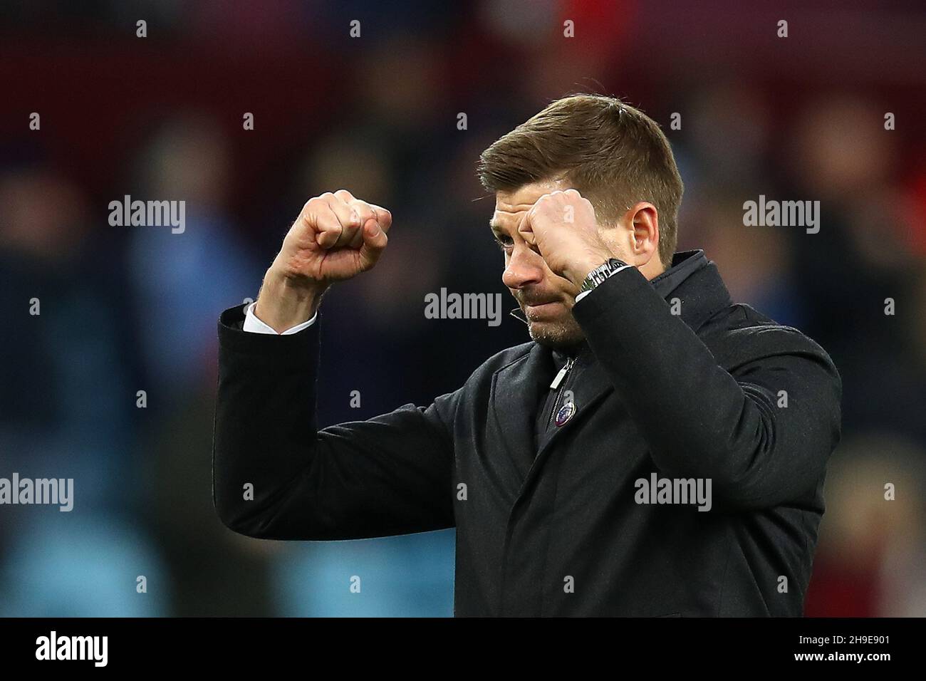 Birmingham, UK. 05th Dec, 2021. Steven Gerrard, the manager of Aston Villa FC salutes the Villa fans after the game. Premier League match, Aston Villa v Leicester City at Villa Park in Birmingham on Sunday 5th December 2021. this image may only be used for Editorial purposes. Editorial use only, license required for commercial use. No use in betting, games or a single club/league/player publications. pic by Andrew Orchard/Andrew Orchard sports photography/Alamy Live news Credit: Andrew Orchard sports photography/Alamy Live News Stock Photo