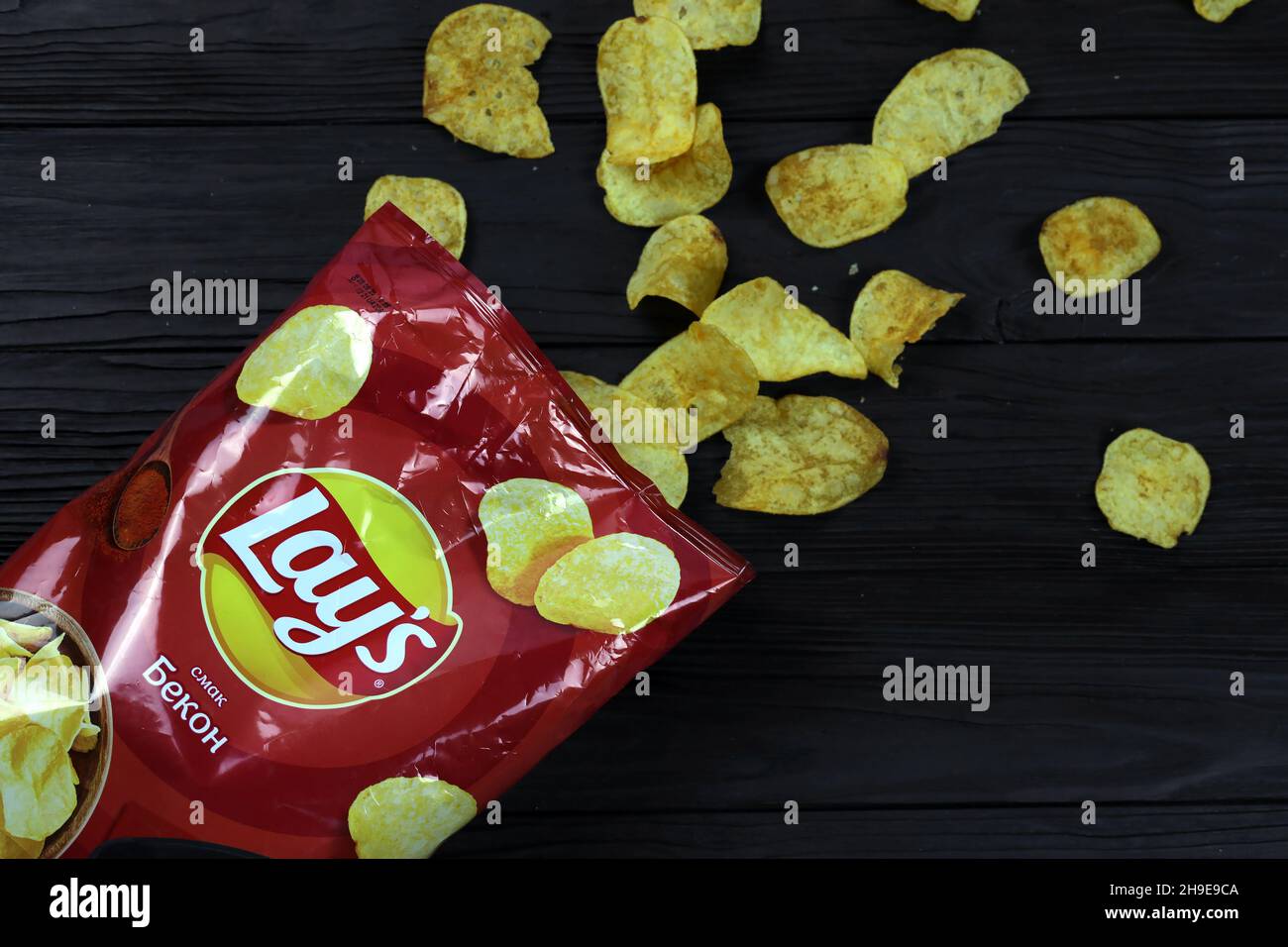 KHARKOV, UKRAINE - JANUARY 3, 2021: Lays potato chips with bacon flavour and original lays logo in middle of package. Worldwide famous brand of potato Stock Photo