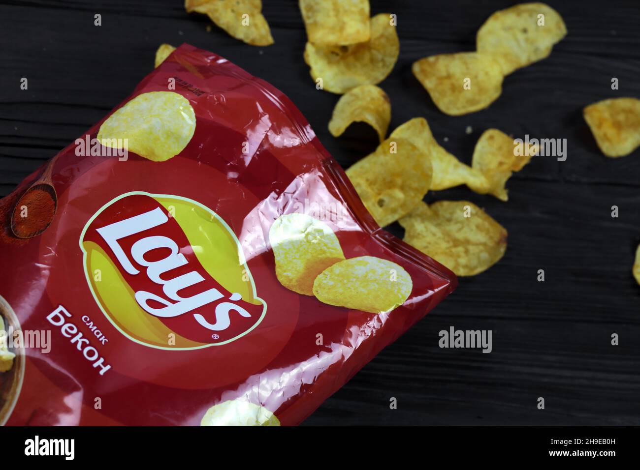 KHARKOV, UKRAINE - JANUARY 3, 2021: Lays potato chips with bacon flavour and original lays logo in middle of package. Worldwide famous brand of potato Stock Photo