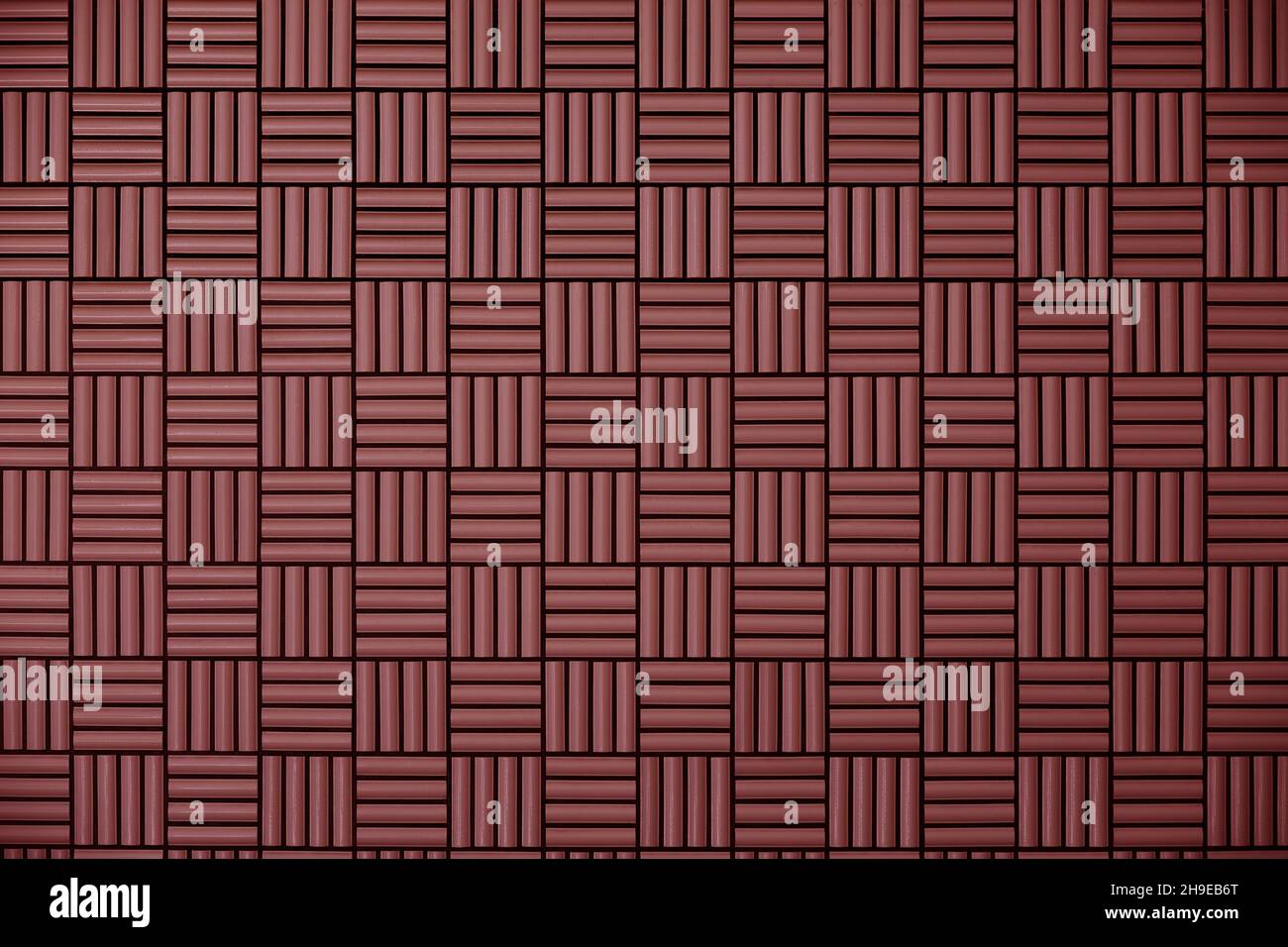 Red tile wall with geometric pattern as background material Stock Photo
