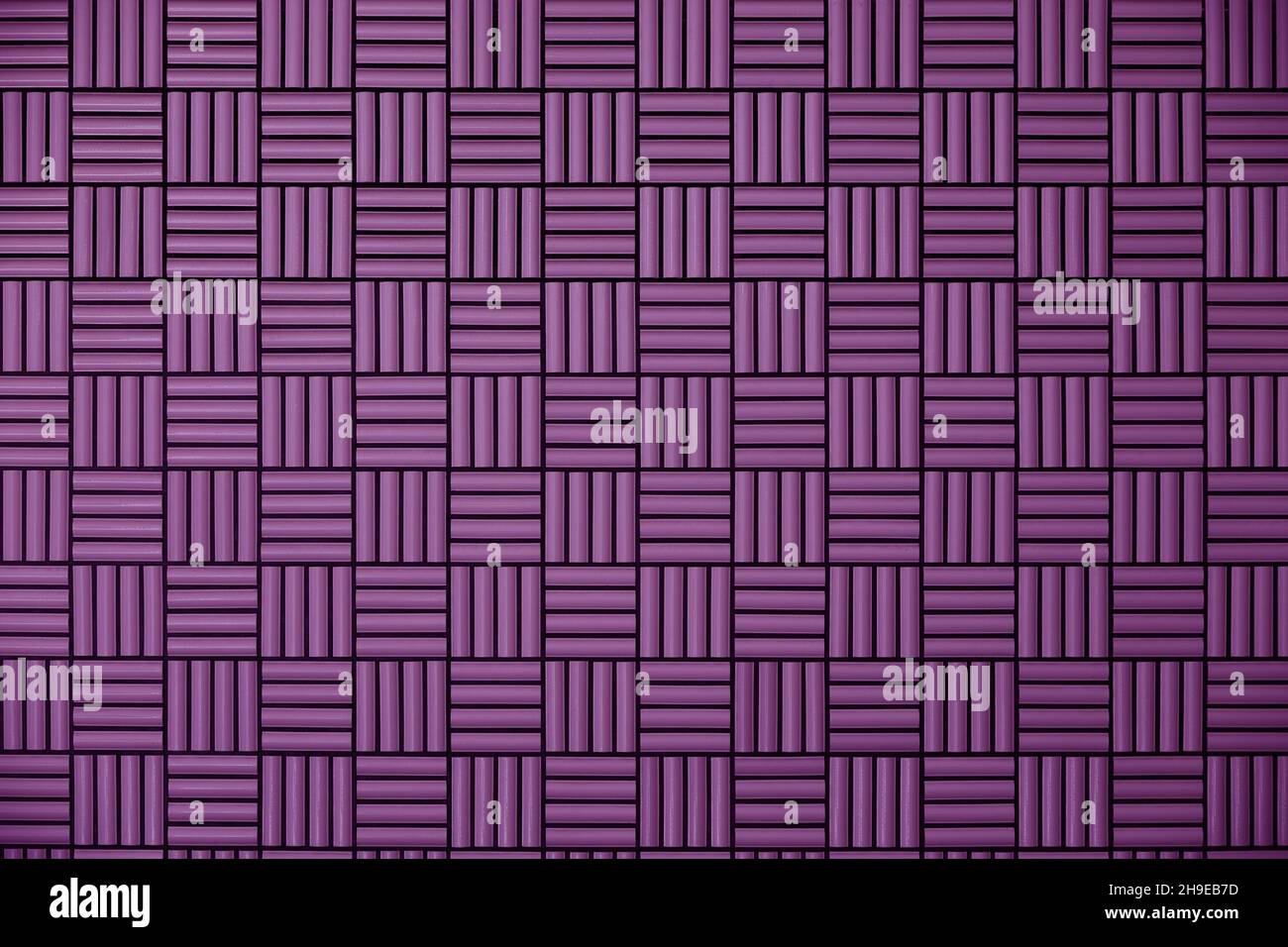 Purple tile wall with geometric pattern as background material Stock Photo