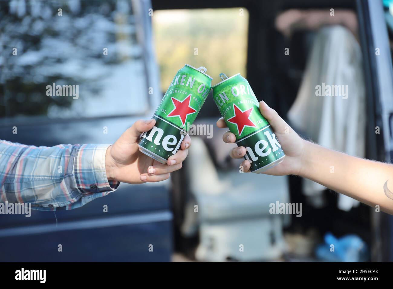 KHARKOV, UKRAINE - JULY 31, 2021: Green tin cans of Heineken pale lager ...