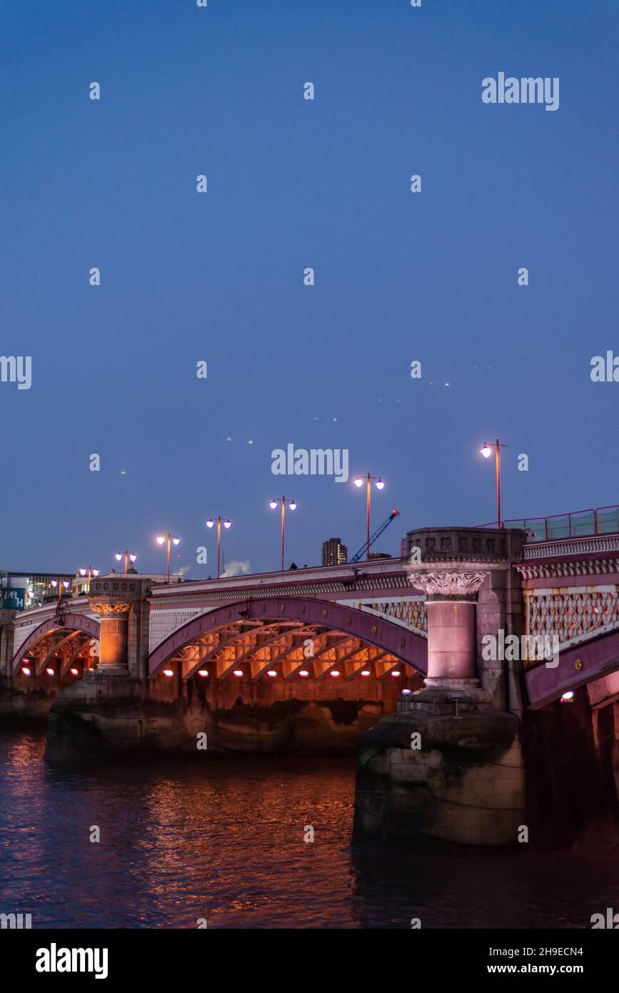 Blackfriars Bridge lit at night, London, England, UK Stock Photo