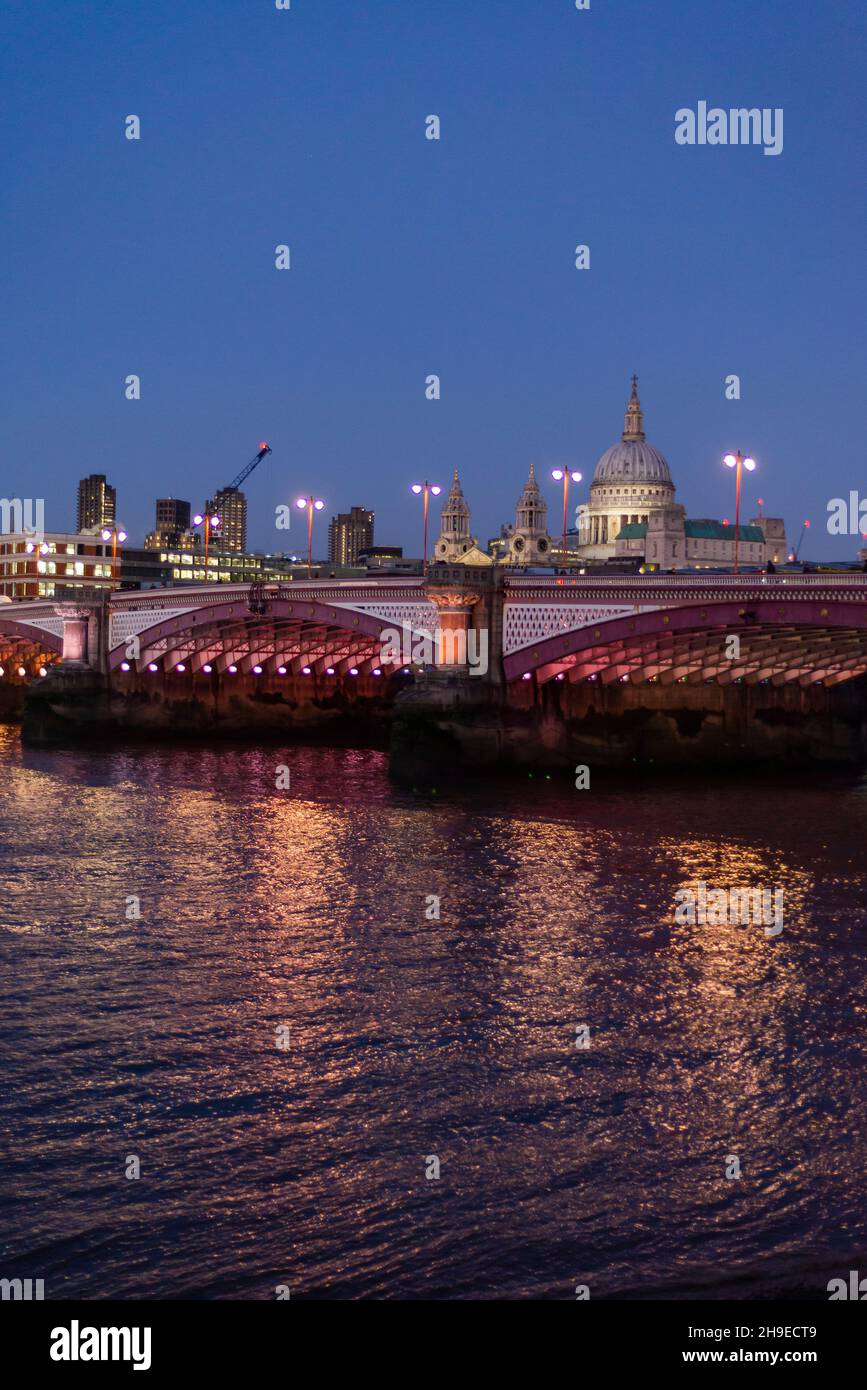 Blackfriars Bridge lit at night and St Pauls cathedral and Square Mile buildings, London, England, UK, London, England, UK Stock Photo