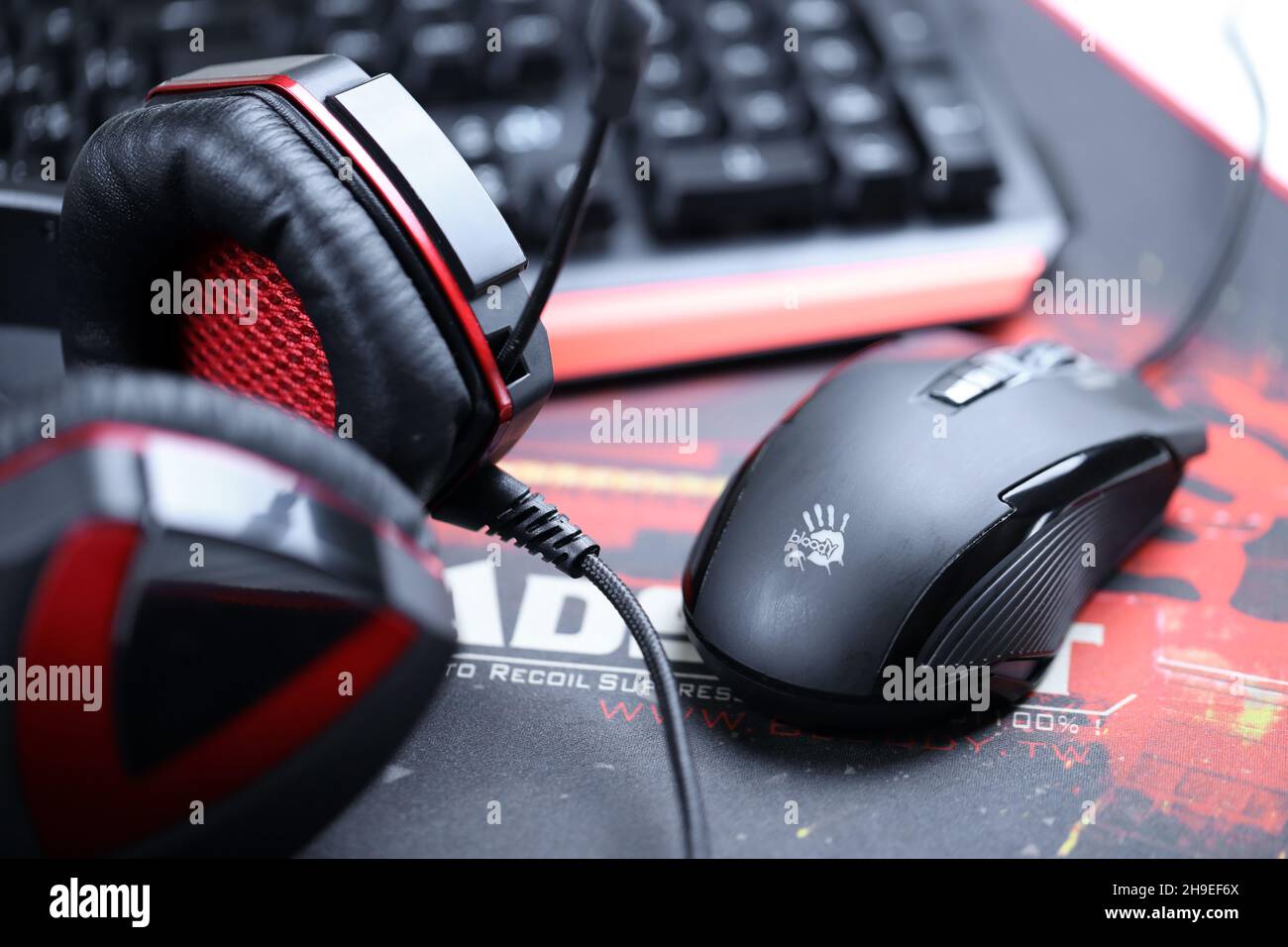 KHARKOV, UKRAINE - MARCH 14, 2021: A4tech bloody B3590R gaming keyboard, G501  headset and P93 optical mouse on B-070 Headshot surface in red and black  Stock Photo - Alamy