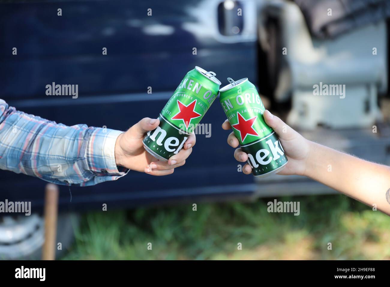 KHARKOV, UKRAINE - JULY 31, 2021: Green tin cans of Heineken pale lager ...