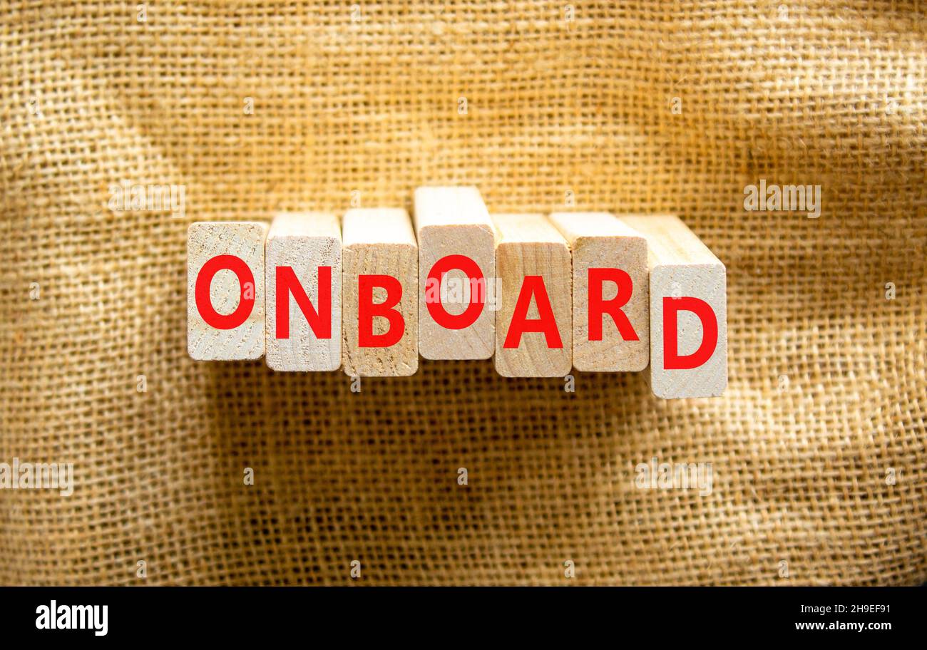 Onboard and onboarding symbol. The concept word Onboard on wooden