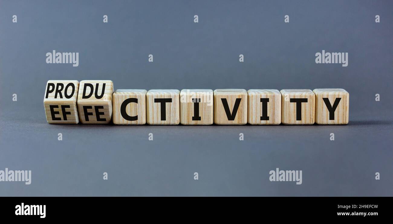 Effectivity and productivity symbol. Turned wooden cubes and changed ...