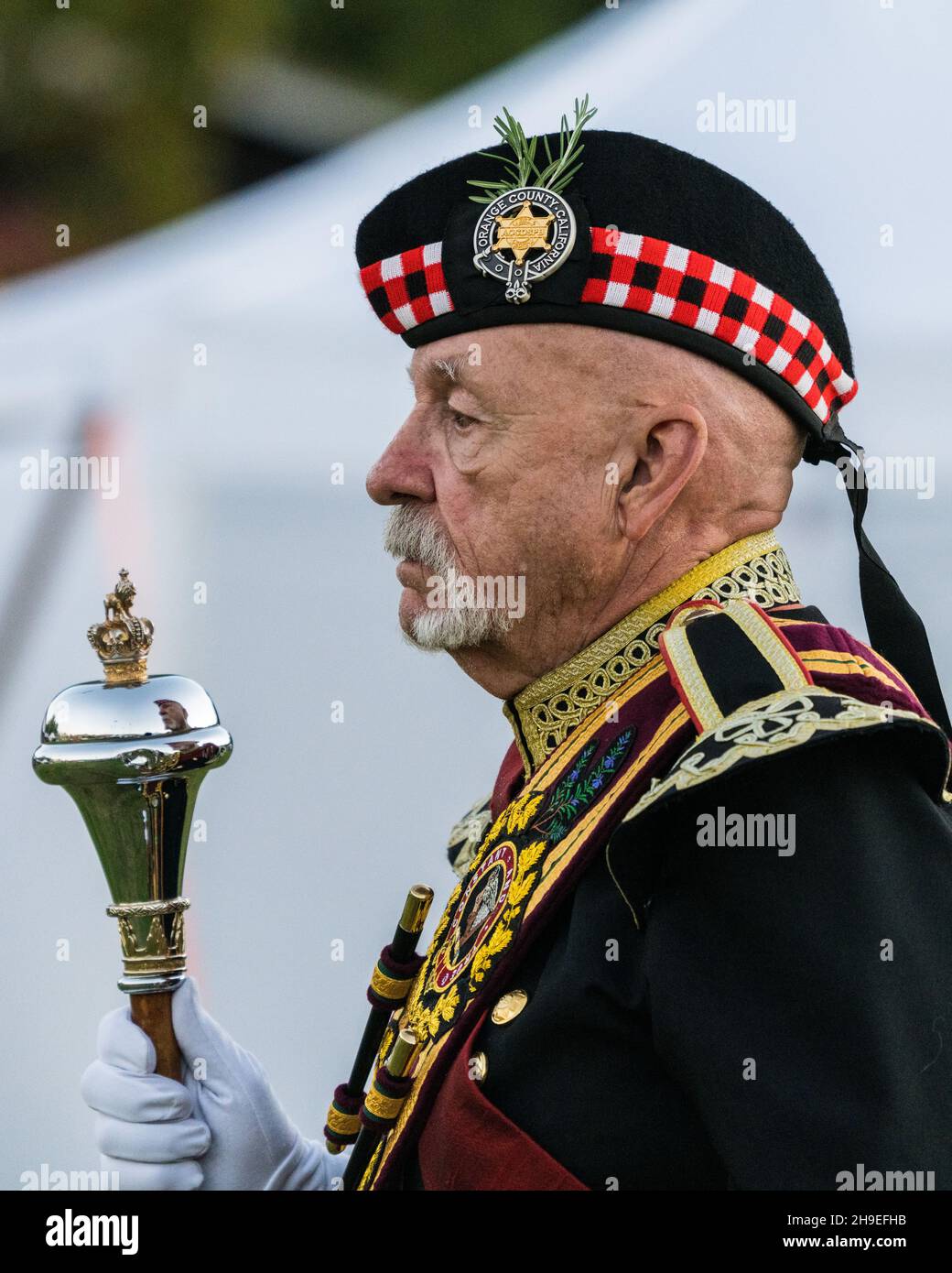 Portrait of a Highland drum major in his Glengarry and his mace