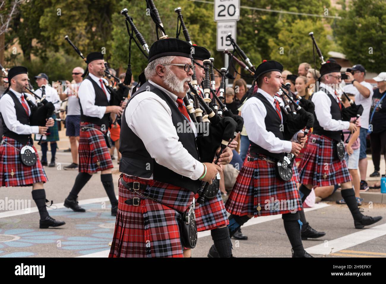 A Scottish pipeband marches in a parade at a Scottish festival in Moab