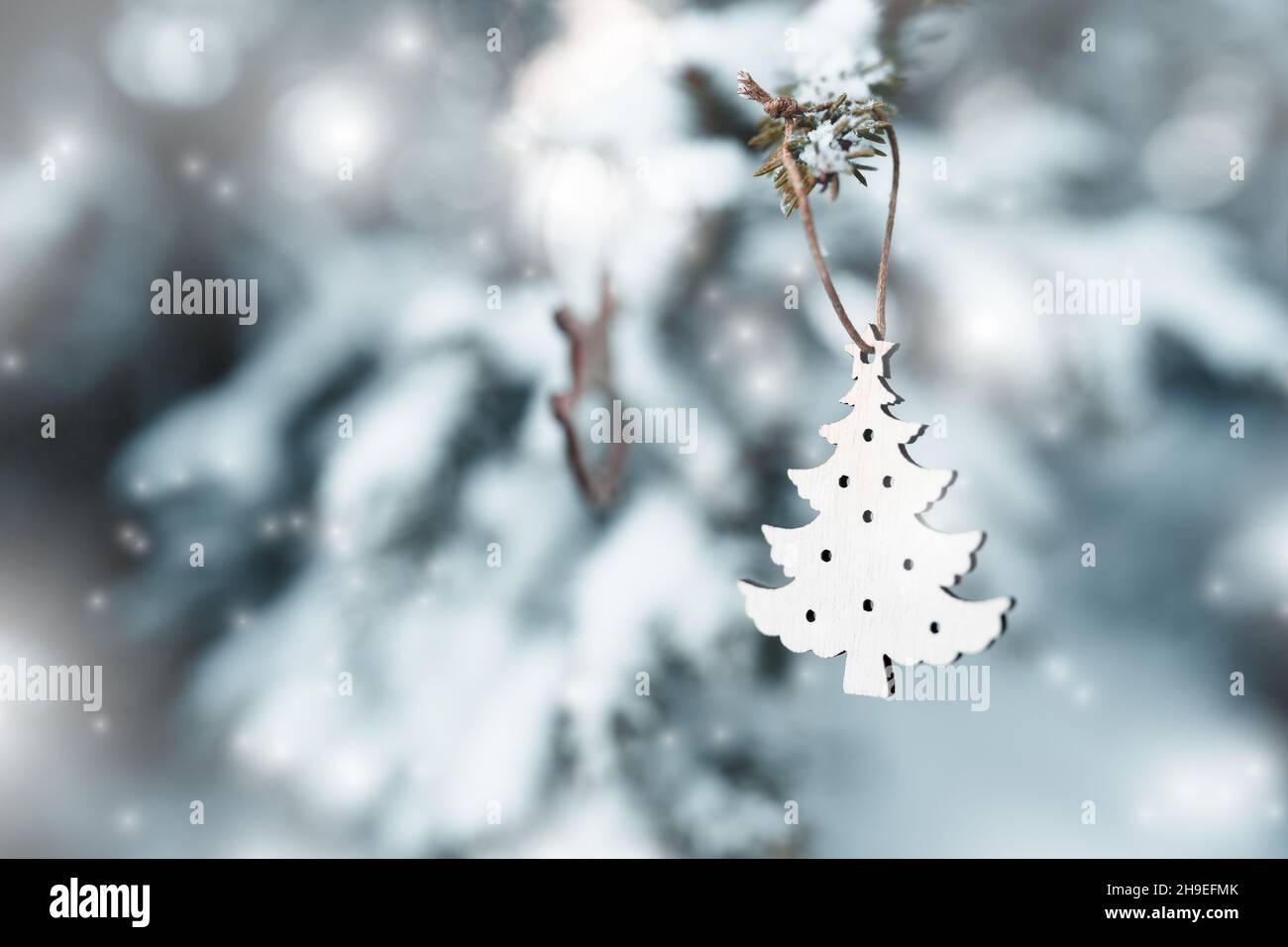 Happy Holidays Merry Christmas Cute Christmas Decoration On A Coniferous Tree Covered With Snow In The Middle Of The Forest Christmas 21 Stock Photo Alamy