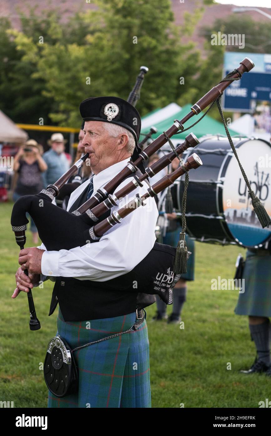 A bagpiper in full regalia performs at a Scottish festival in Moab