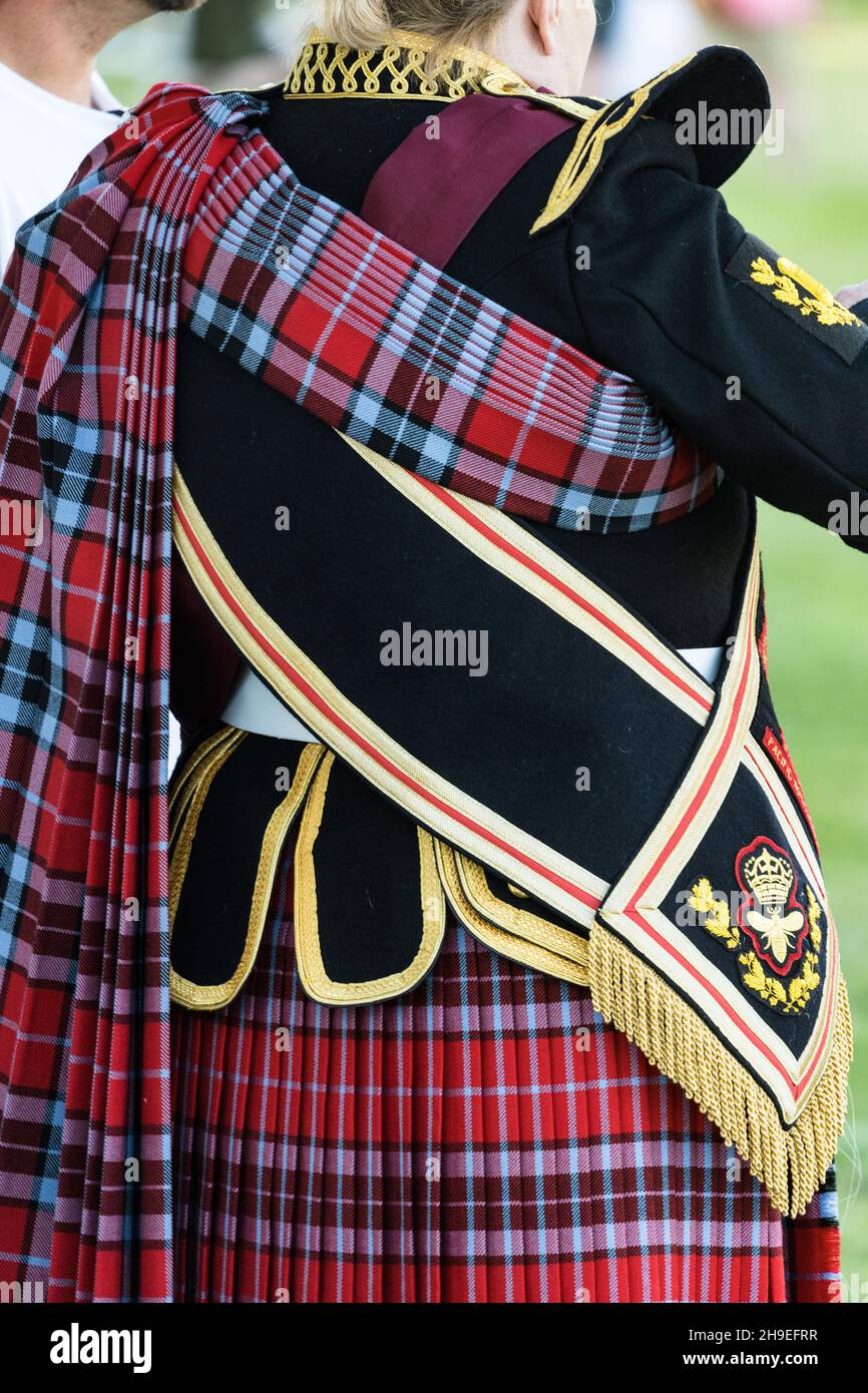Detail of a Scottish Highland drum major's uniform and tartan at a
