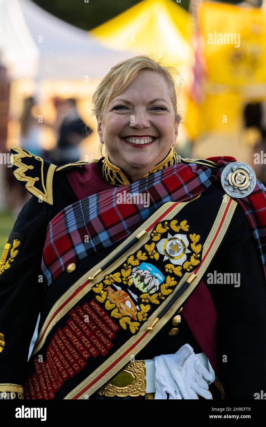 A HIghland pipe band drum major in her full regalia at a Scottish