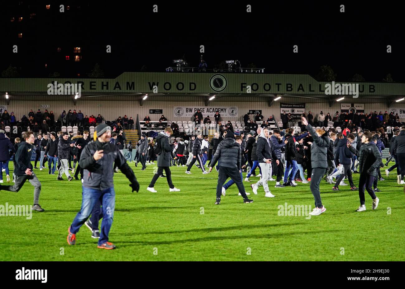 Boreham Wood fans invade the pitch after the final whistle following