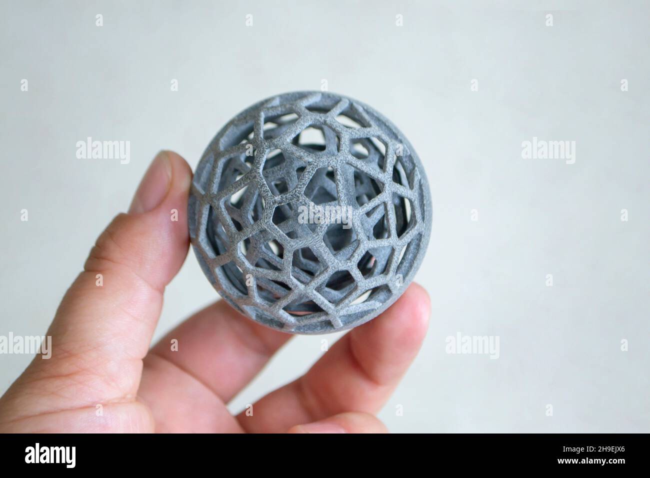 Man holding in hand model printed on 3D printer. Powder industrial 3D ...