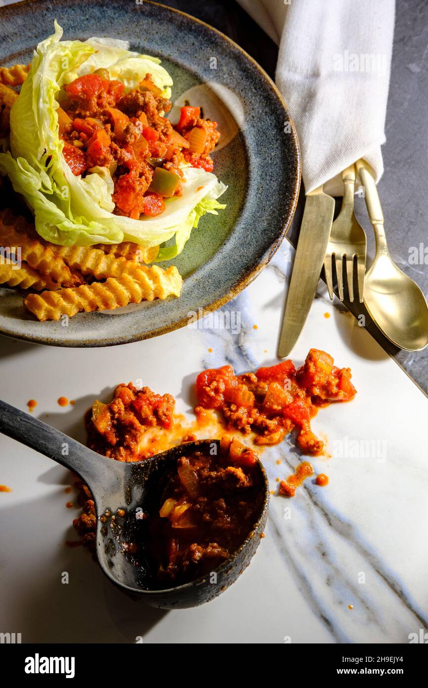 Sloppy Joe lettuce wraps with crinkle cut french fries Stock Photo Alamy