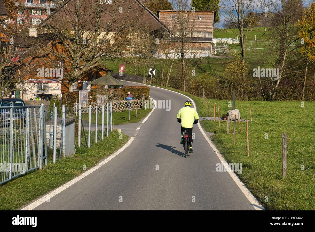 Rear view of man riding bike cycle bicycle hi-res stock photography and ...