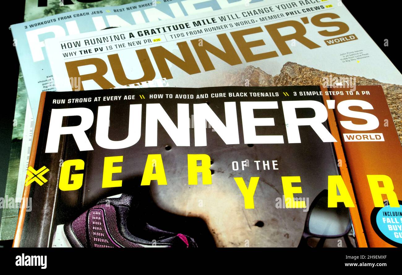 Assorted issues of Runner's World magazine; a periodical for running enthusiasts, practitioners, fans of the sport; owned by Hearst Communications. Stock Photo