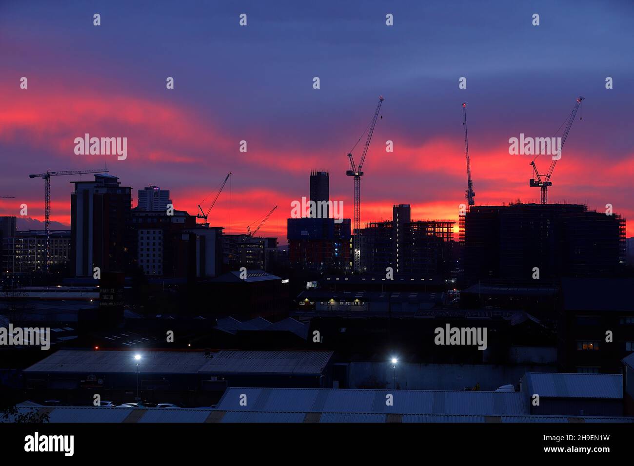 Sunrise behind The Junction development in Leeds City Centre Stock Photo