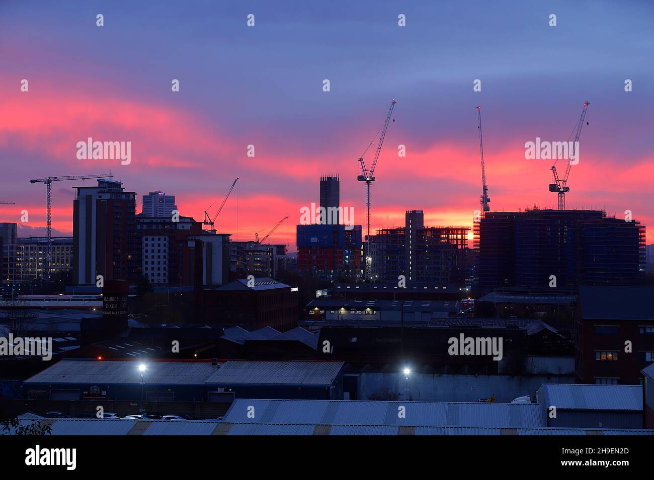 Sunrise behind The Junction development in Leeds City Centre Stock Photo