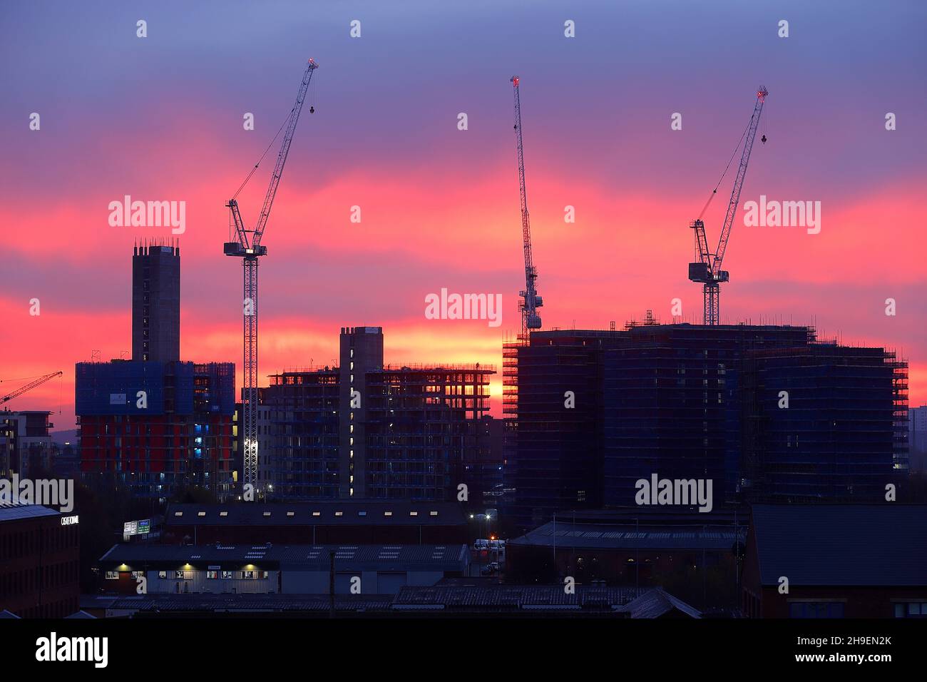 Sunrise behind The Junction development in Leeds City Centre Stock Photo