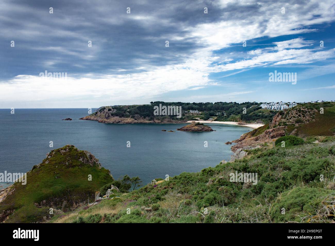 The Channel Islands of Jersey, Guernsey and Sark in summer with sun, clear  skies and green nature with beach Stock Photo - Alamy