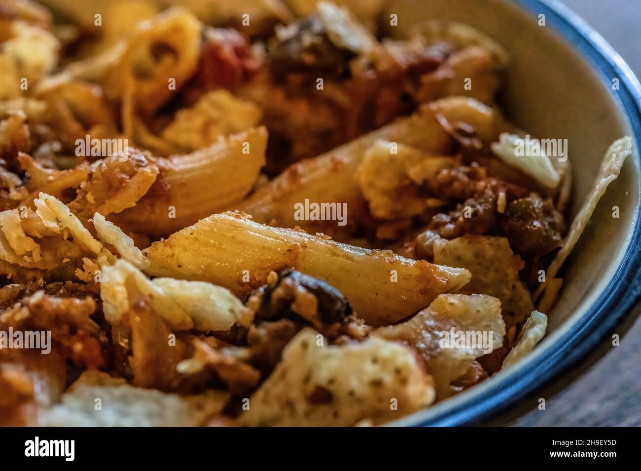Taco penne pasta casserole with tortilla chips Stock Photo Alamy