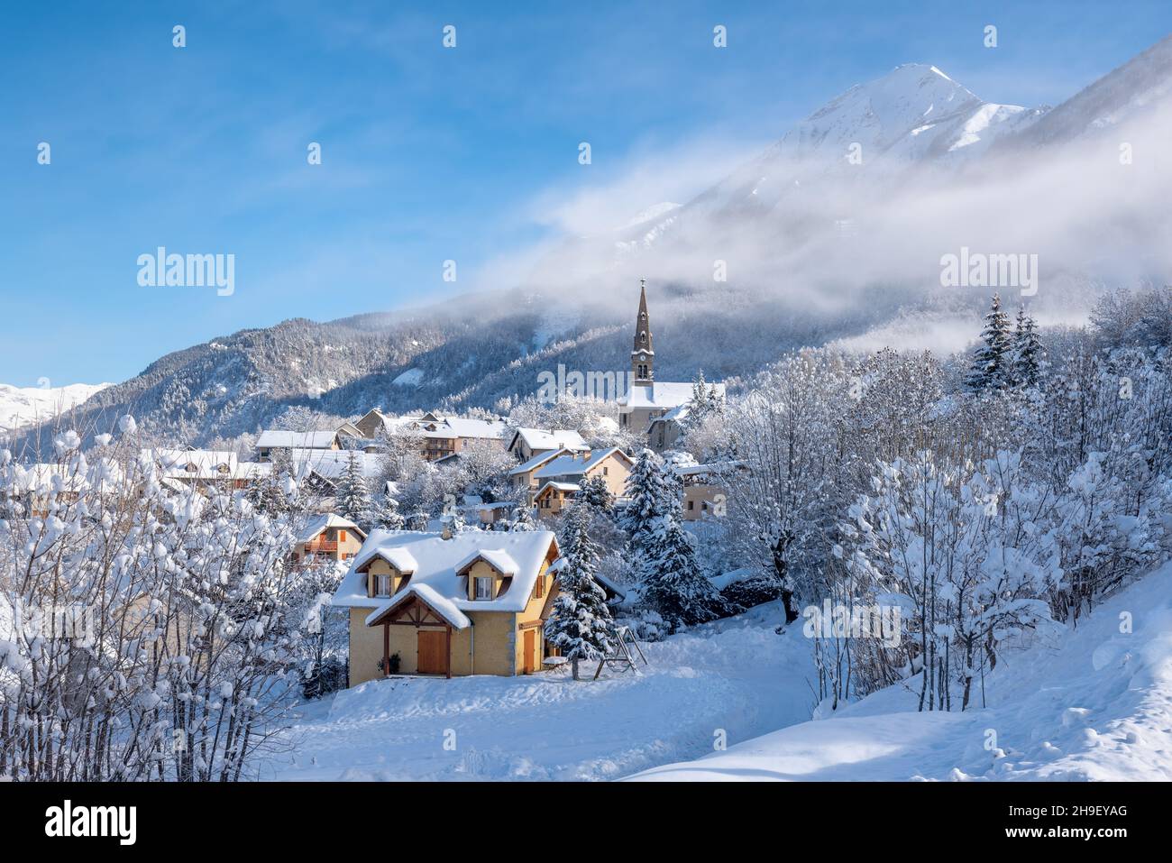 The village of Saint Leger les Melezes in the Hautes-Alpes covered in snow  in winter. Ski resort in the Ecrins National Park, French Alps. France  Stock Photo - Alamy
