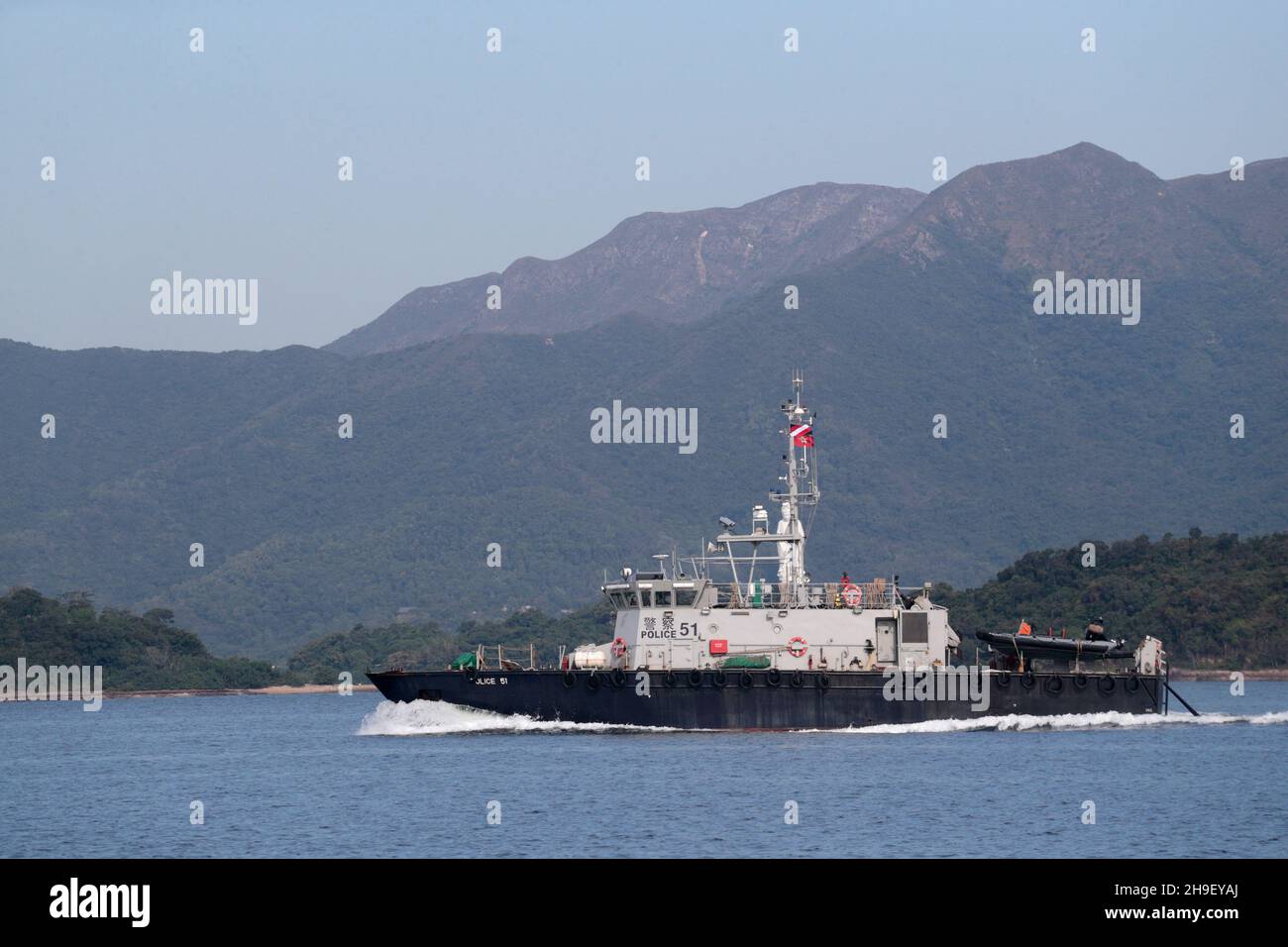 Police Launch 51, side view in Tolo Harbour with Pat Sin Hills in background, New Territories, Hong Kong 27th Nov 2021 Stock Photo