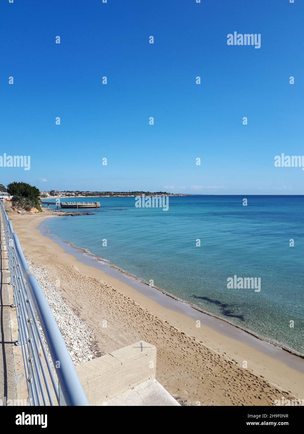 Beautiful scenery of Avola beach and the chalet in the background in
