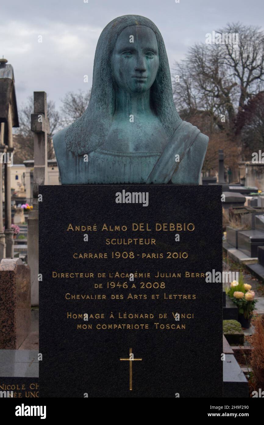 The grave of Sculptor Andre Almo Del Debbio - with a bronze bust inspired by the Mona Lisa - in Montparnasse Cemetery, Paris, France Stock Photo