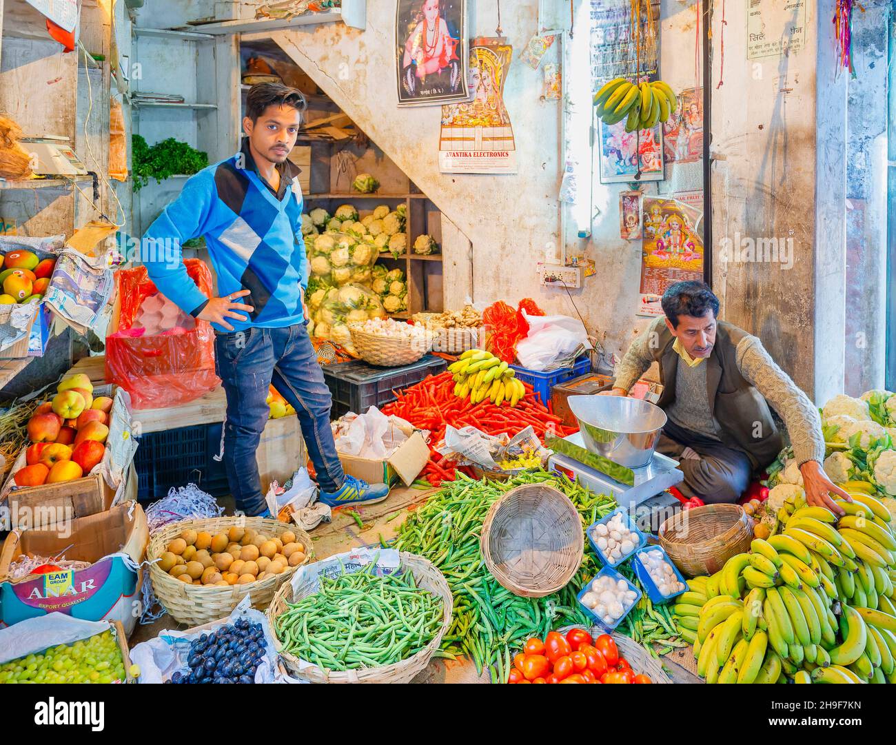 Shopkeepers tend a roadside fruit and vegetable shop in Pragpur, a heritage village in Kagra district, Himachal Pradesh, India Stock Photo