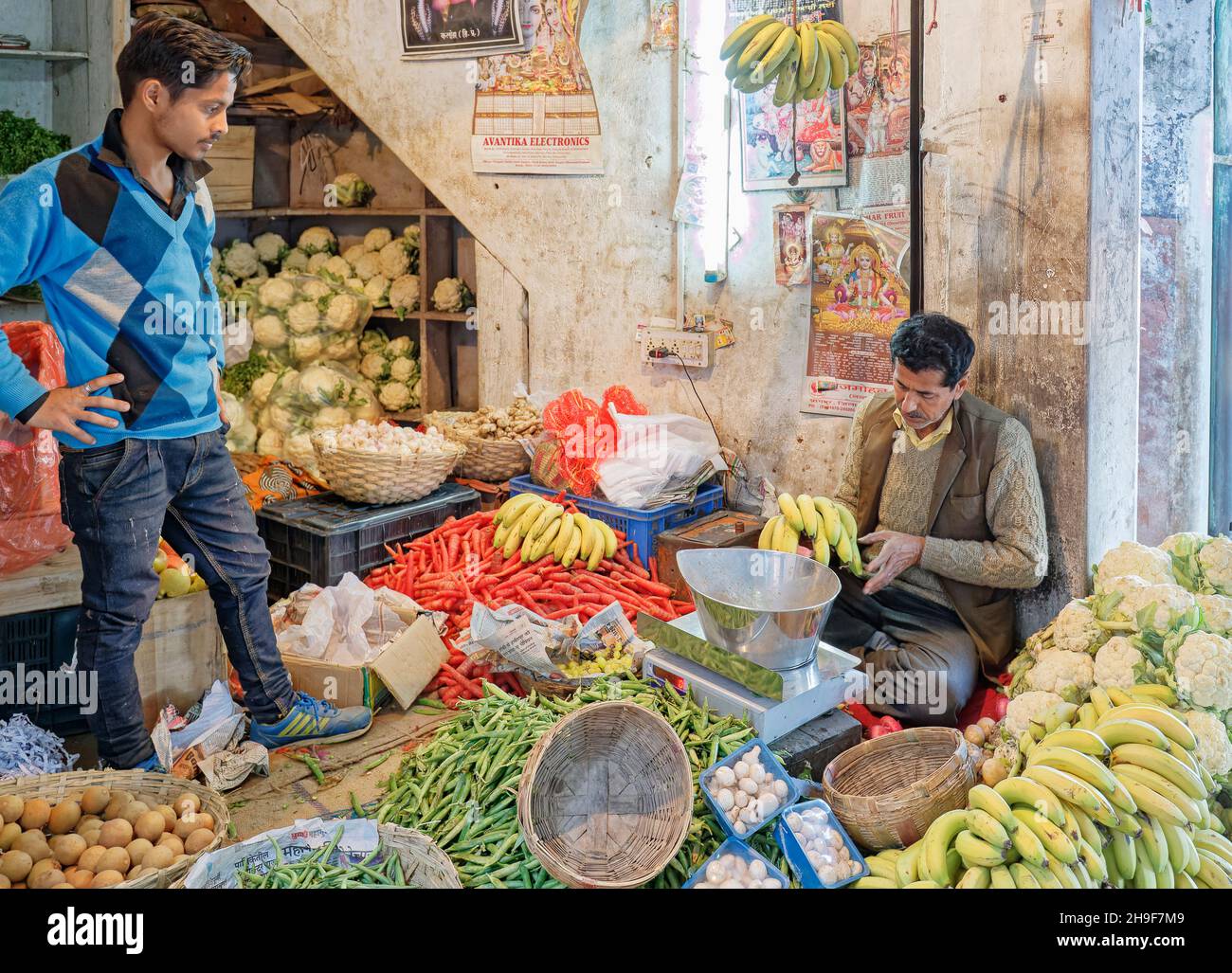 Shopkeepers tend a roadside fruit and vegetable shop in Pragpur, a heritage village in Kagra district, Himachal Pradesh, India Stock Photo