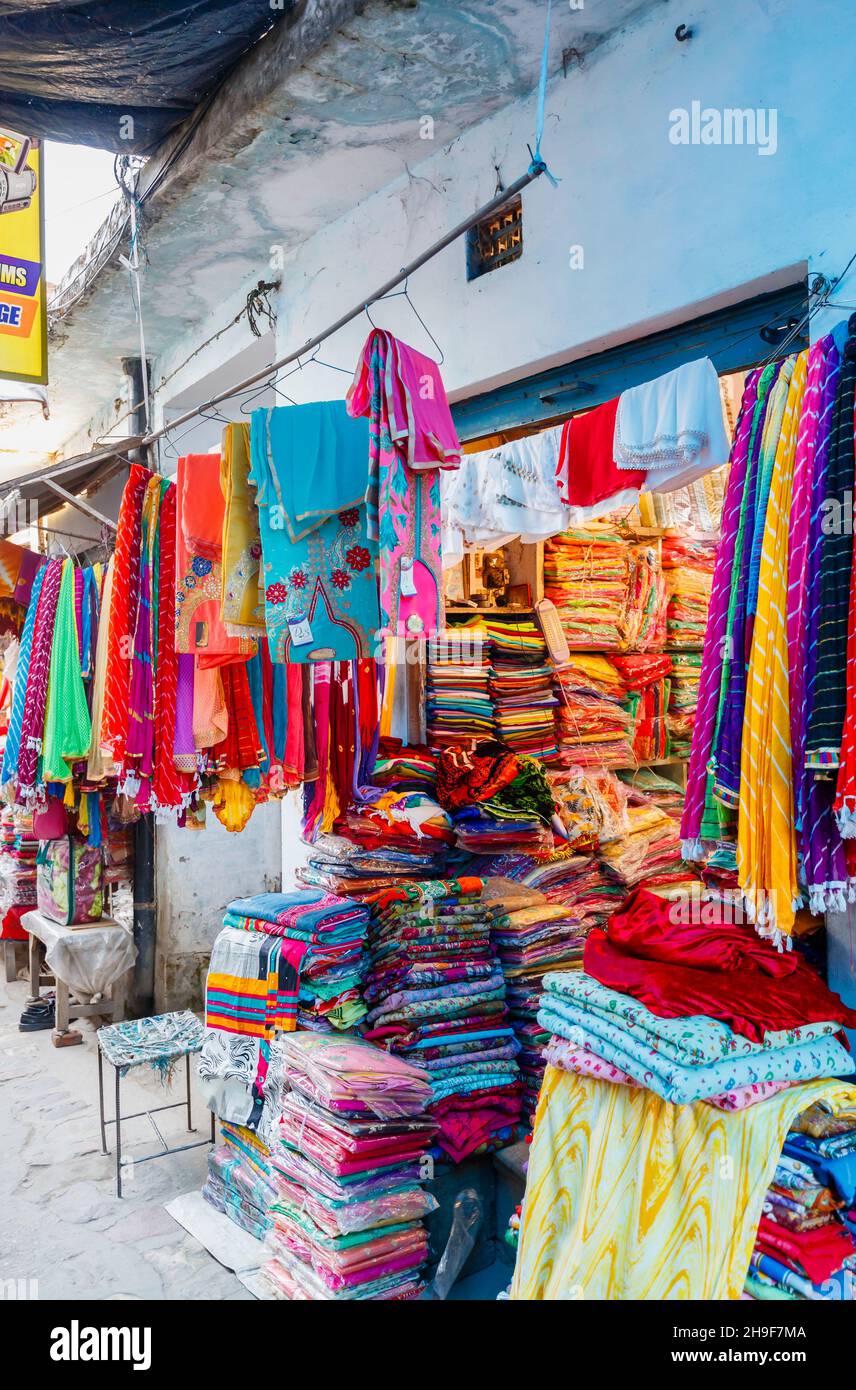 Shop selling colourful local clothes and fabrics in Pragpur, a heritage