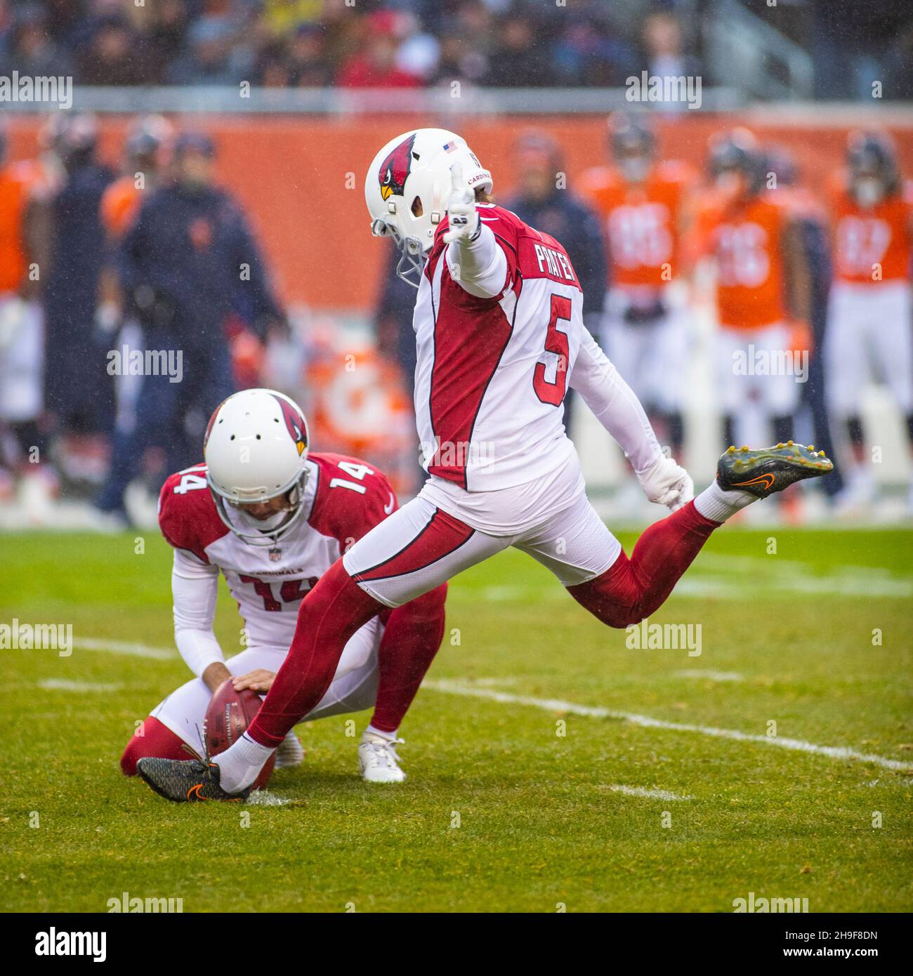 December 05, 2021: Chicago, Illinois, . - Cardinals #14 Andy Lee holds  the ball for kicker #5 Matt Prater during the NFL Game between the Arizona  Cardinals and Chicago Bears at Soldier