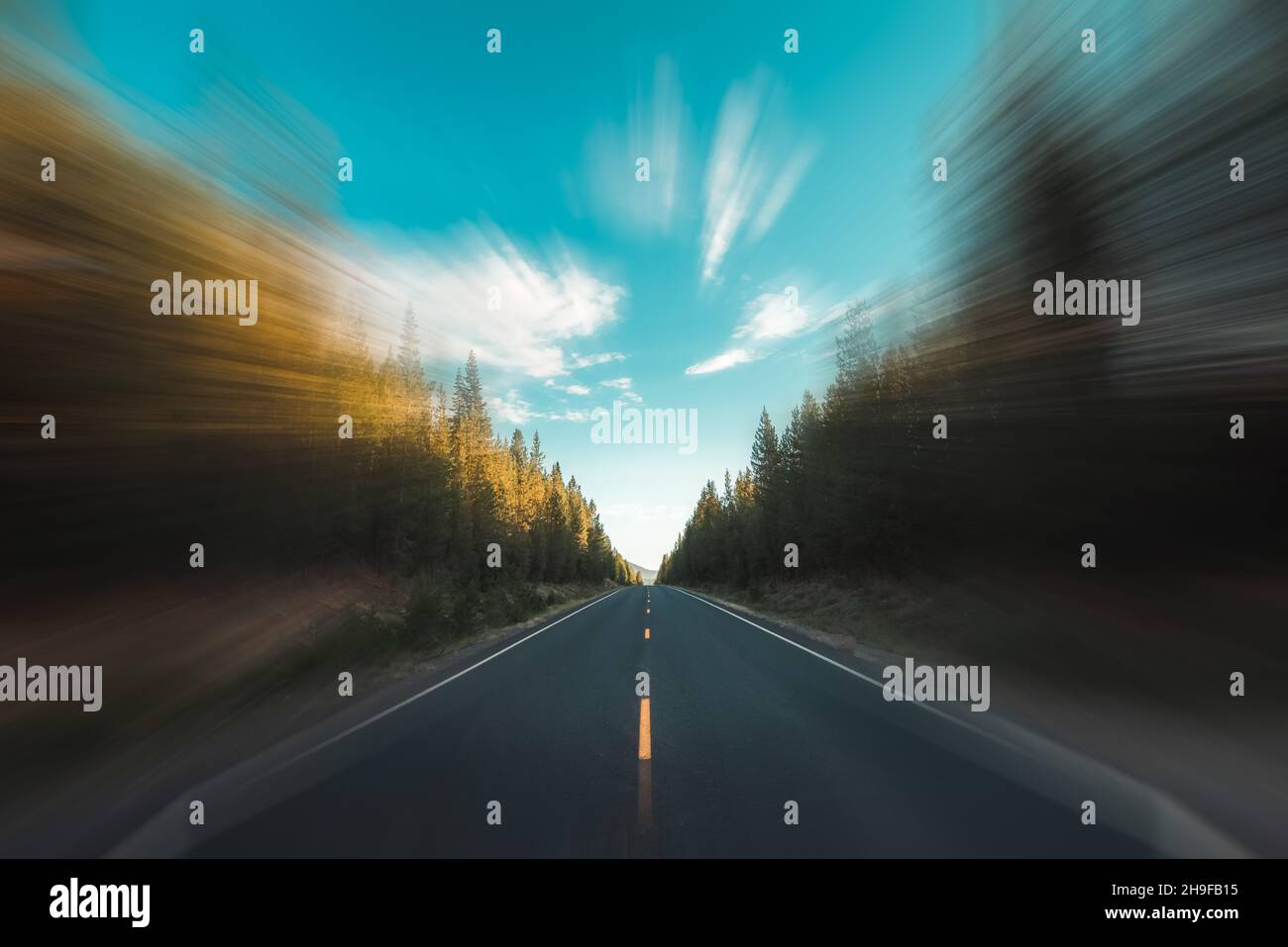 Highway Oregon diminishing perspective at dawn. Selective blur. Stock Photo