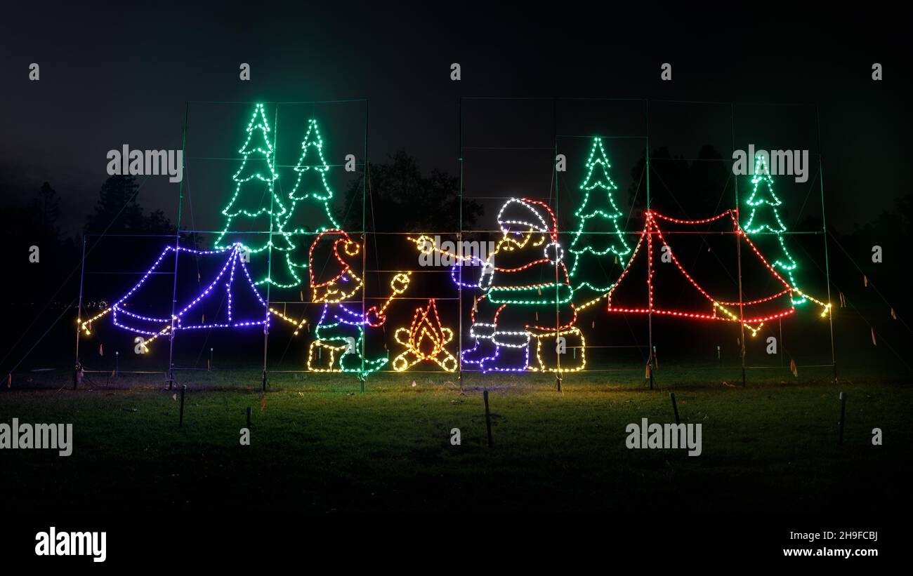 Santa family roasting marshmallow by campfire at the Fantasy of Lights