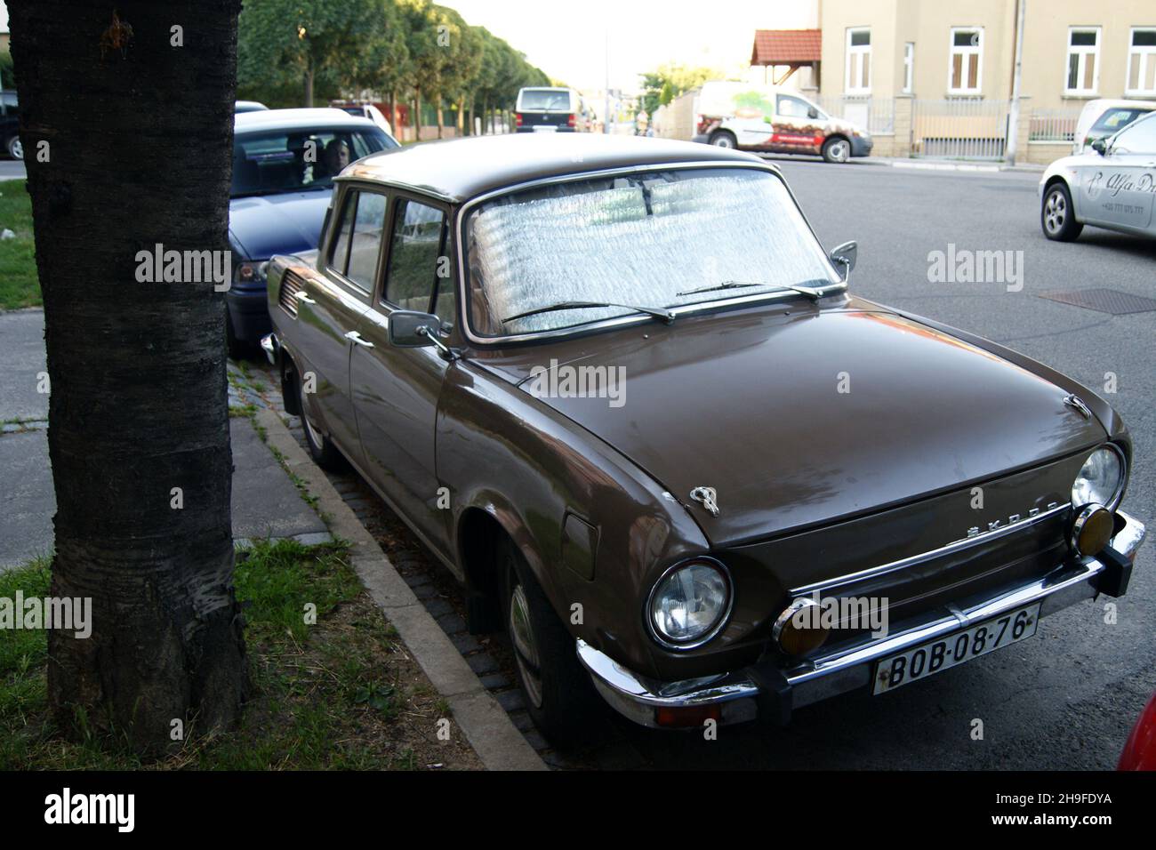 Socialist era 1970-s Czechoslovak-made Skoda 100-series car parked by sidewalk, Brno, Czechia Stock Photo