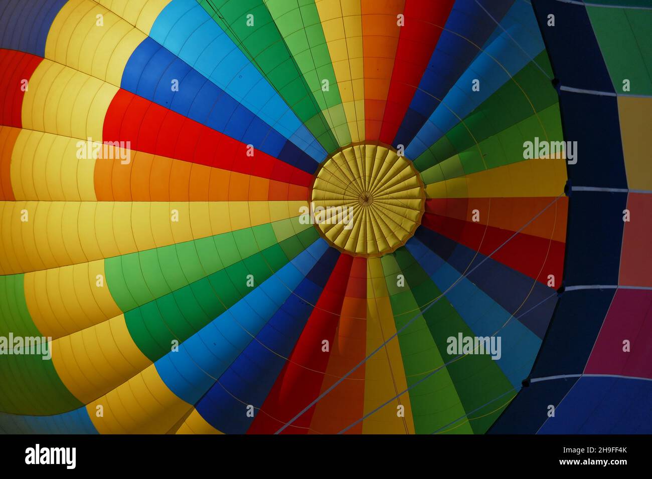 Symmetrical pattern of colorful hot air balloon viewed from below Stock Photo