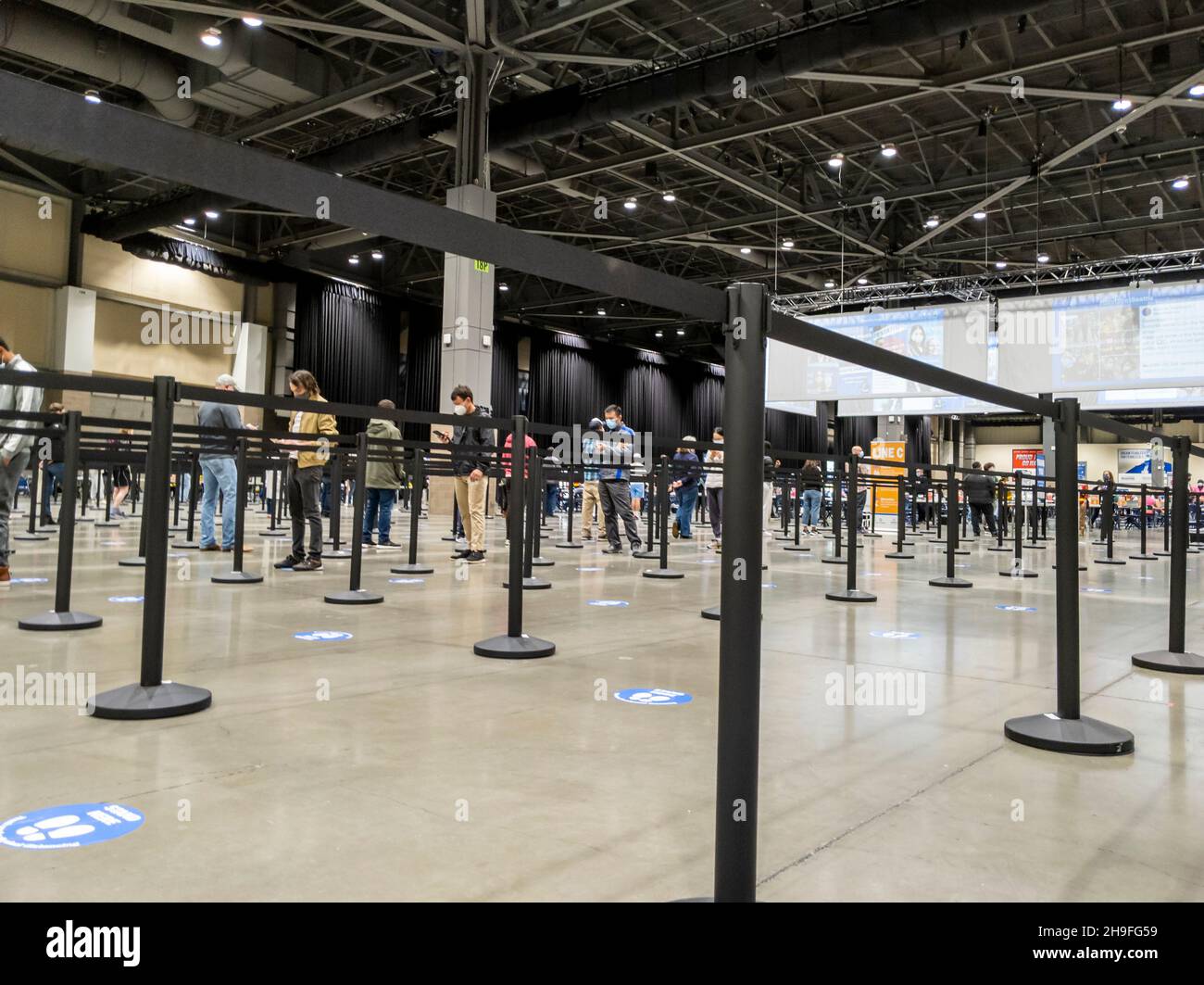 Seattle, WA USA - circa May 2021: View of separated lines for people to queue up for health screenings before getting the covid 19 vaccine. Stock Photo